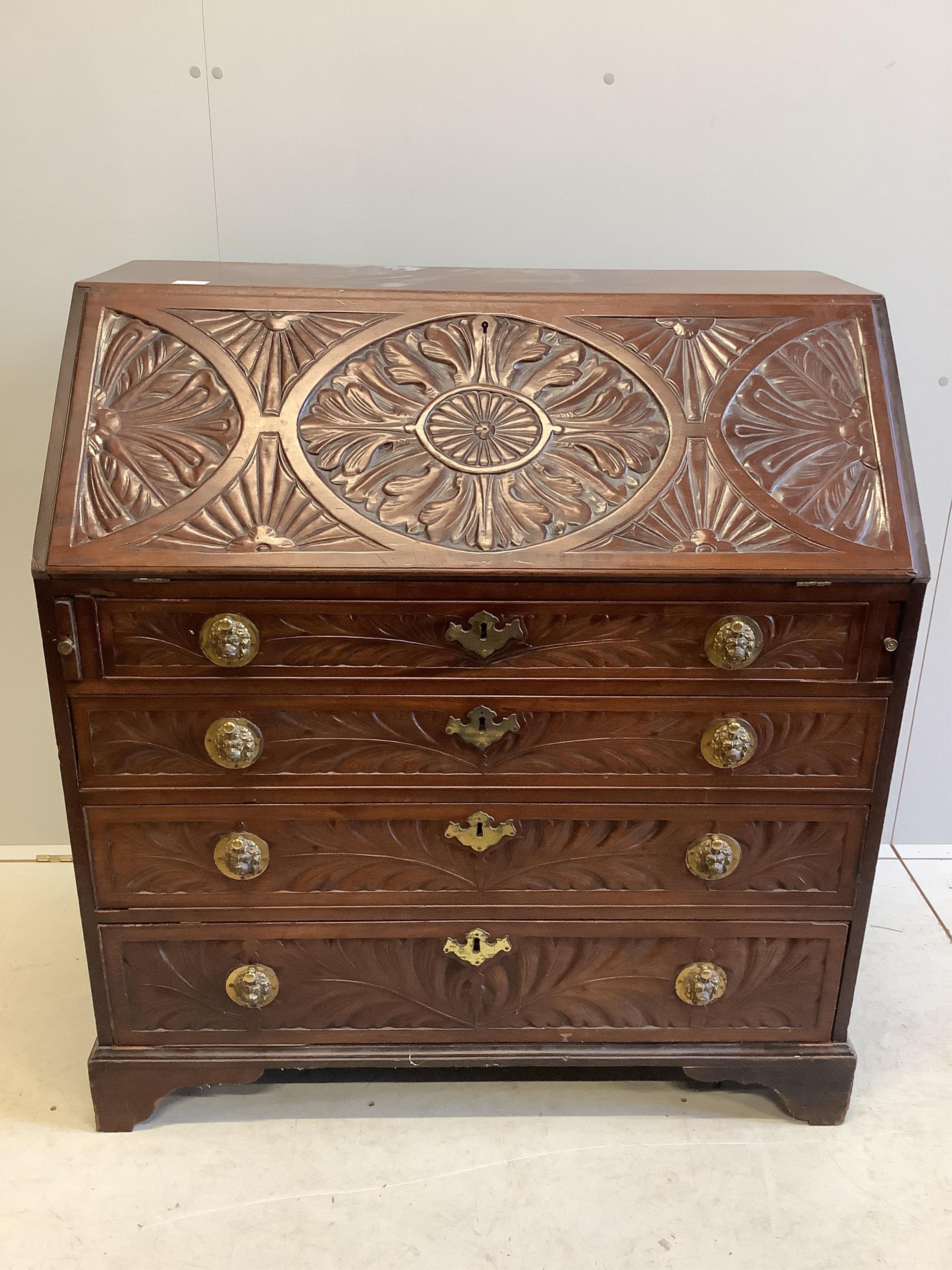 A George III later carved mahogany bureau, width 99cm, depth 56cm, height 106cm. Condition - fair